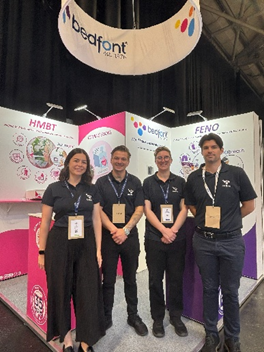 Members of the Bedfont team at an industry expo, standing at the Bedfont stand and showcasing the company.